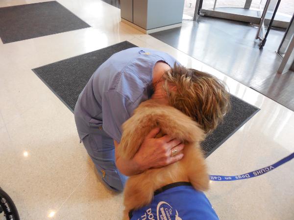Tucker receives a hug from VCU Health NM
