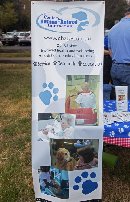 The Center for Human-Animal Interaction's banner includes photos of patients interacting with therapy dogs and states 
